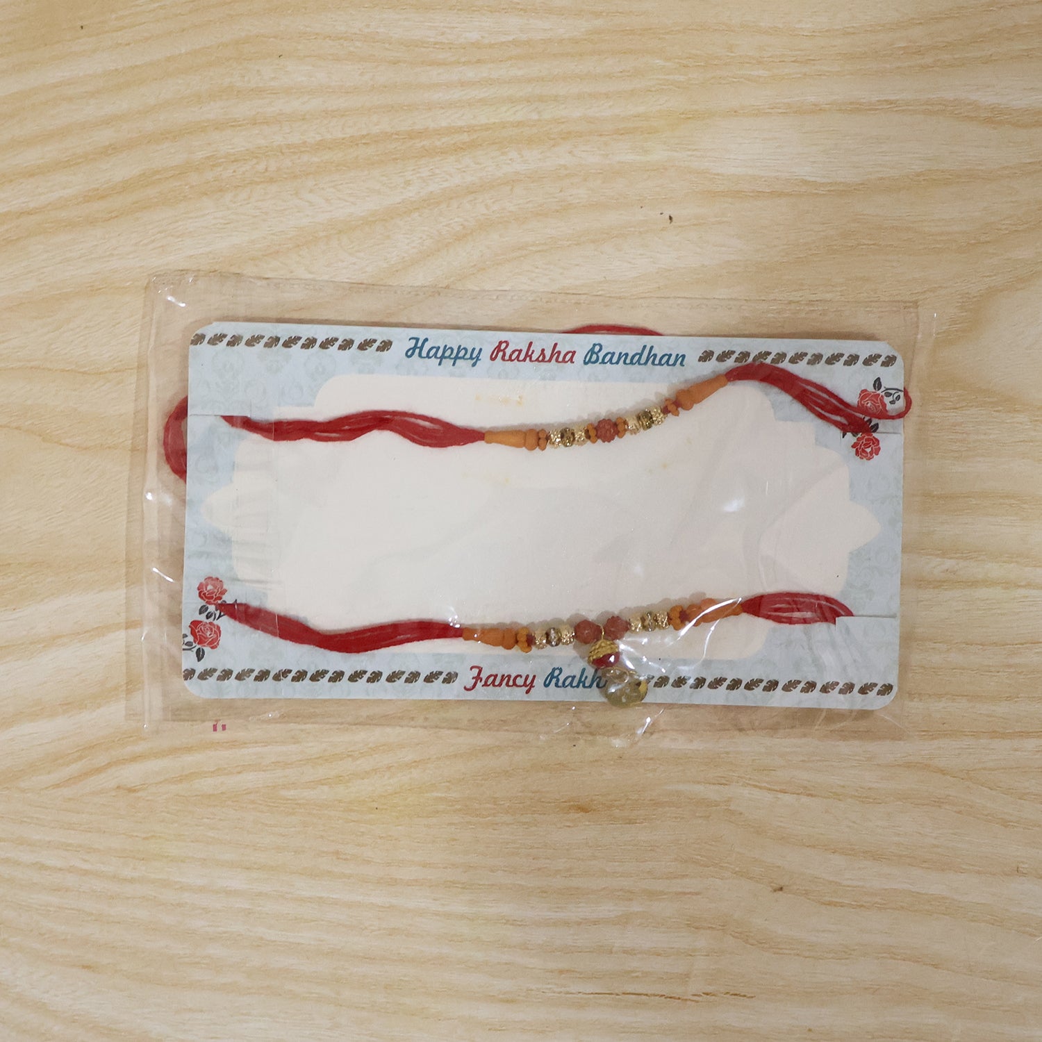 Elegant Rudraksha Bead Bhabhi Rakhi with Om Charm packaging