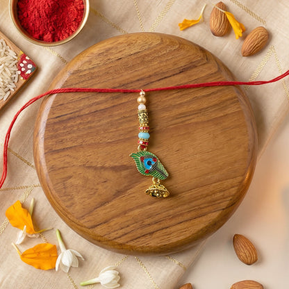 Side view of Peacock Bhabhi Rakhi showing thread