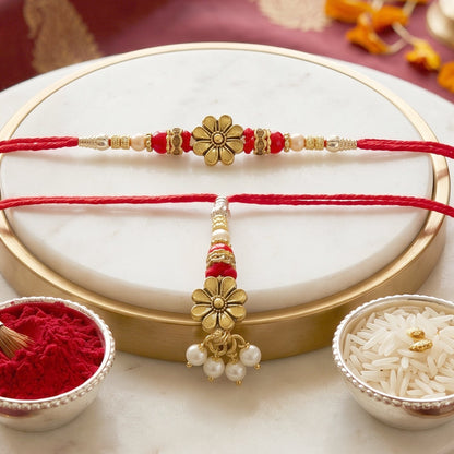 Golden floral designer Rakhi with pearl beads on hand