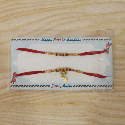 Full display of elegant golden beaded Bhabhi Rakhi on white background