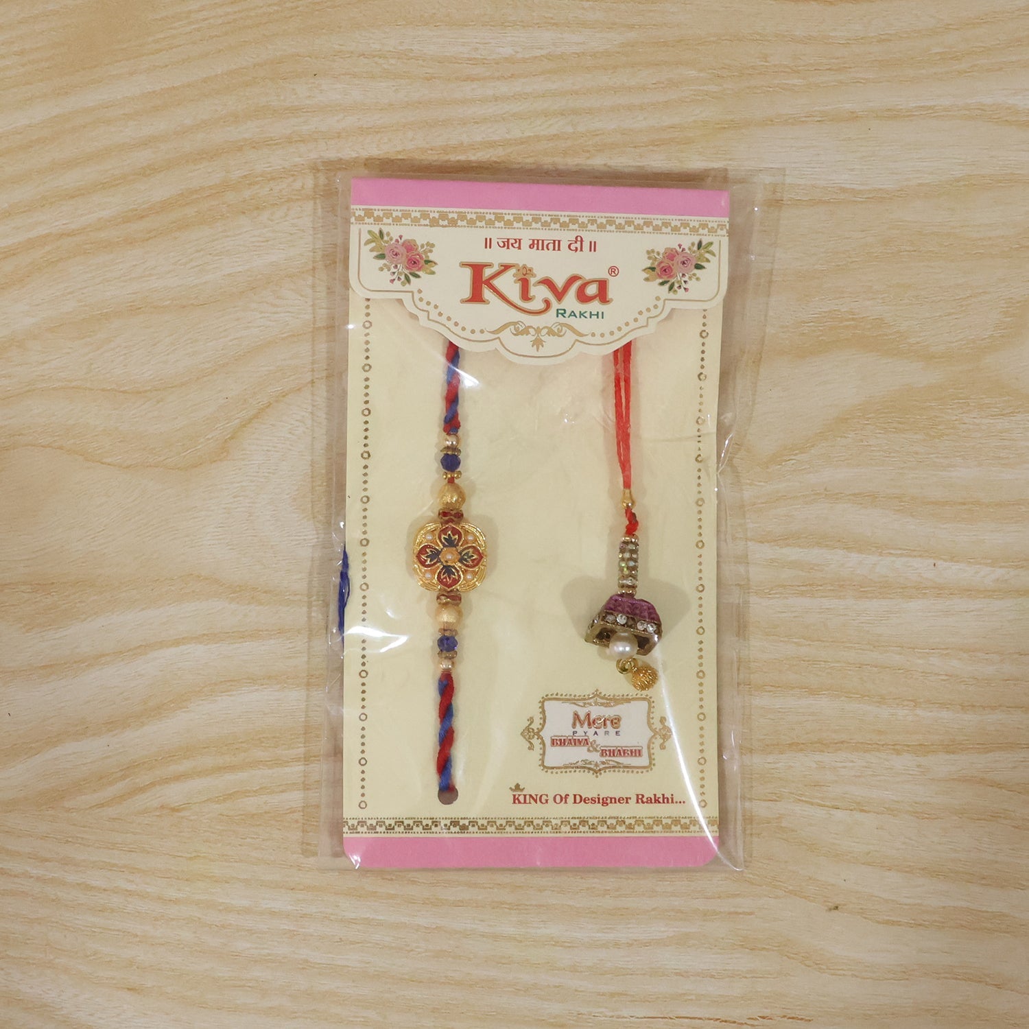 Elegant floral rakhi featuring peacock latkan and pearls