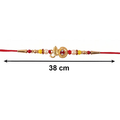 Designer rakhi with religious golden ganesha motif and pearls