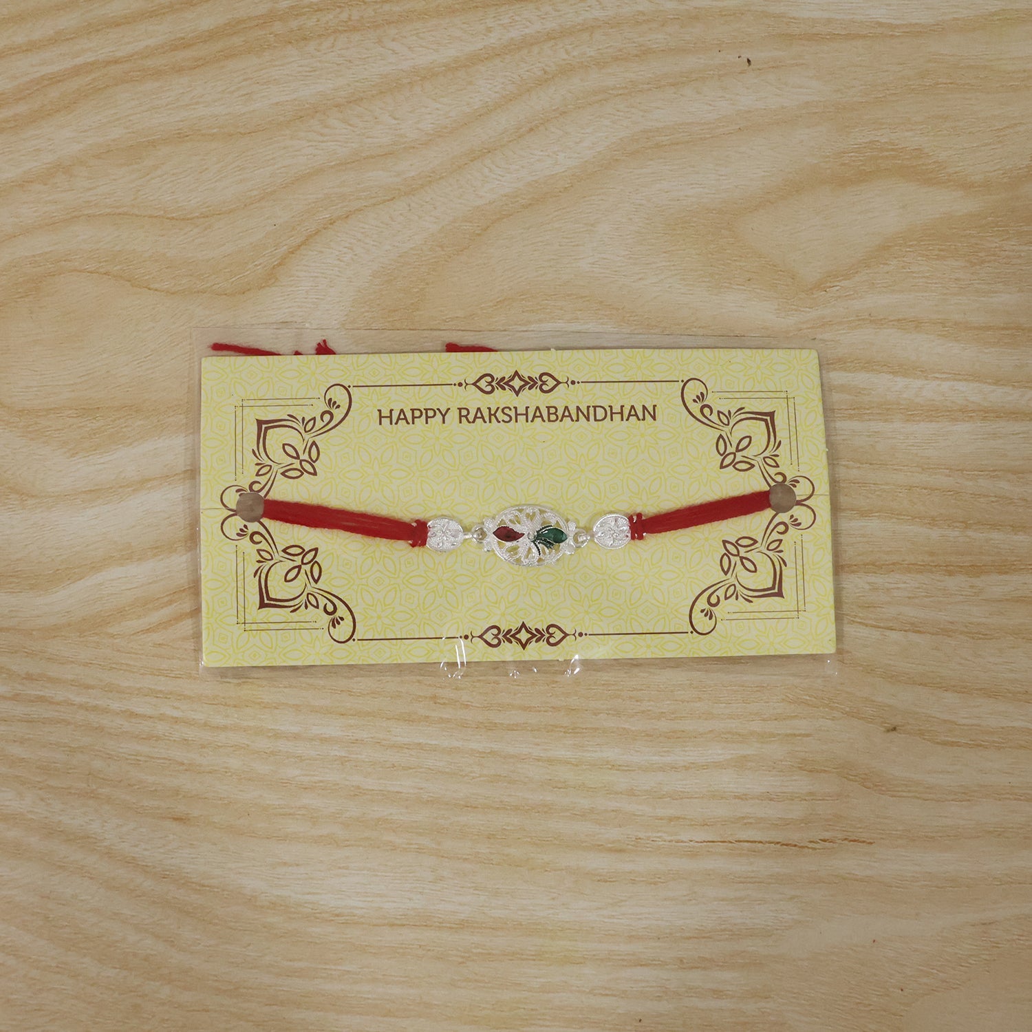 Silver Oval Design Rakhi with Red Thread (1 Pc)