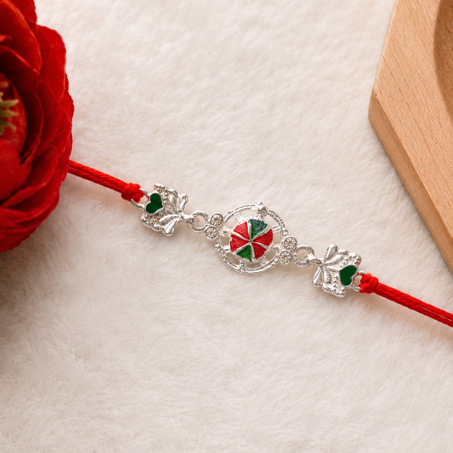 Silver Floral Design Rakhi with Red Thread (1 Pc)