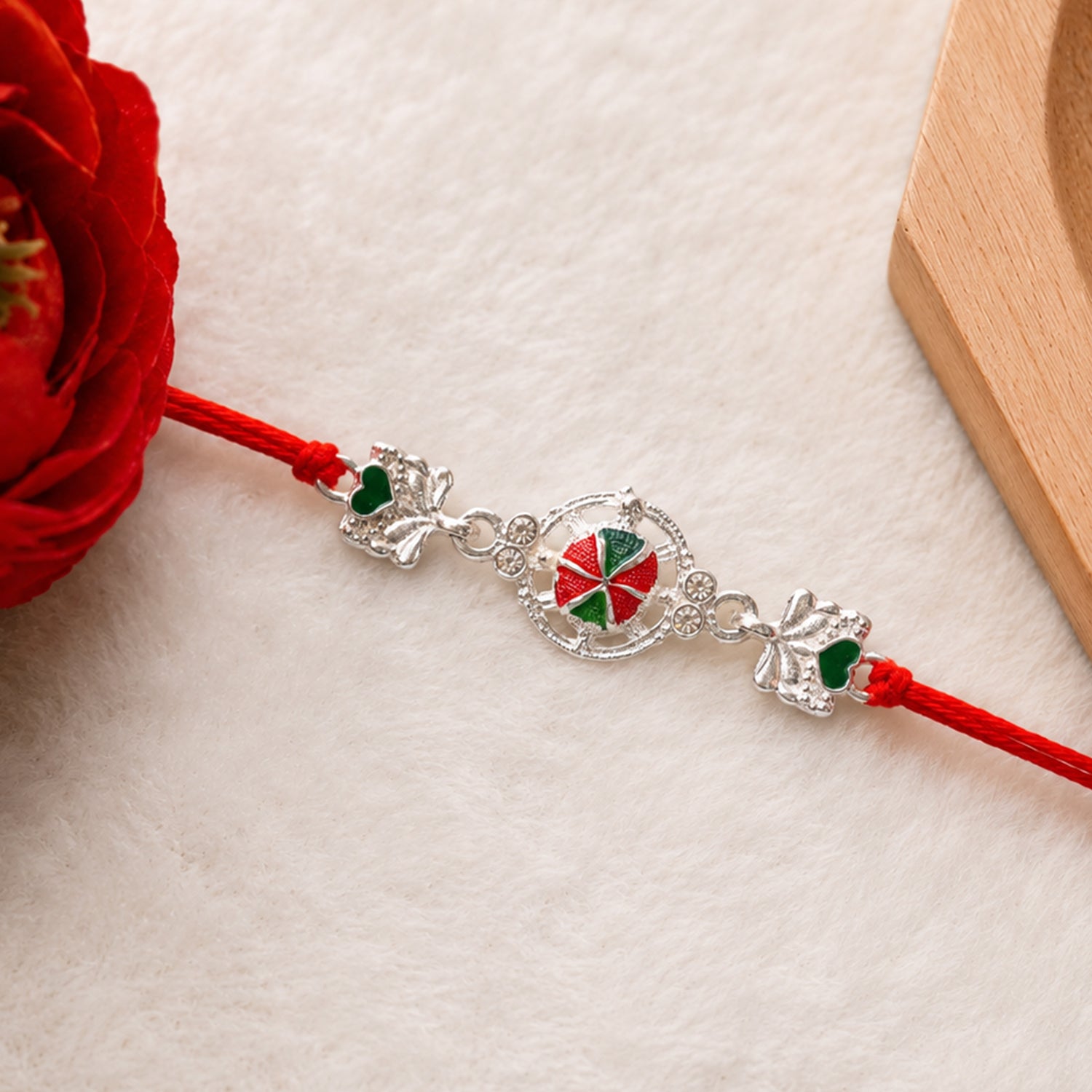 Silver Floral Design Rakhi with Red Thread (1 Pc)