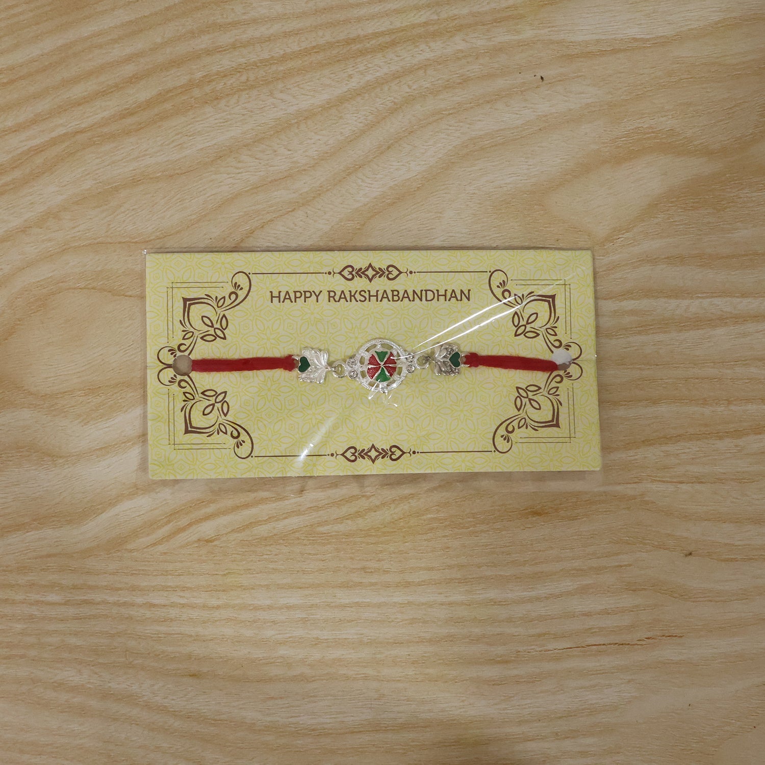 Silver Floral Design Rakhi with Red Thread (1 Pc)