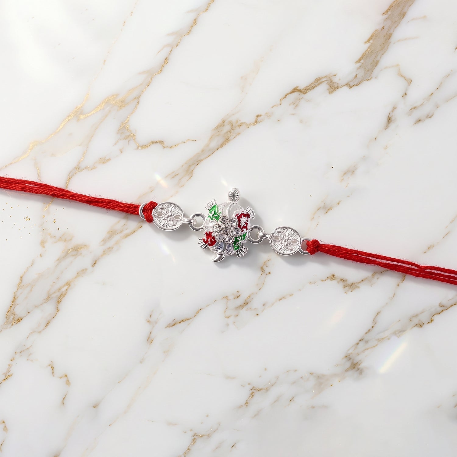 Detailed close-up of enamel floral design on rakhi