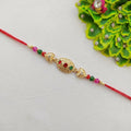Golden Oval Rakhi – Vibrant Bead Decor for Sister’s Festival