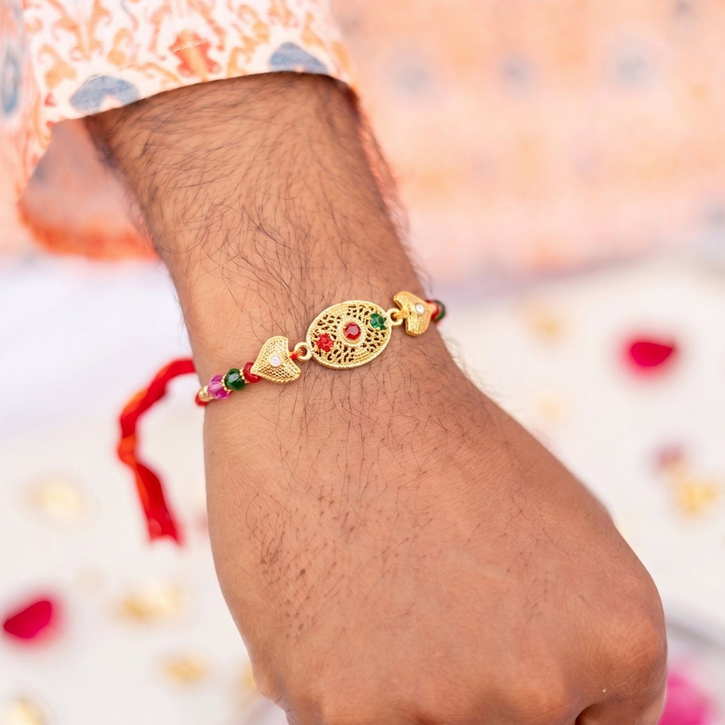 Close-up of golden Rakhi centerpiece with vibrant beads