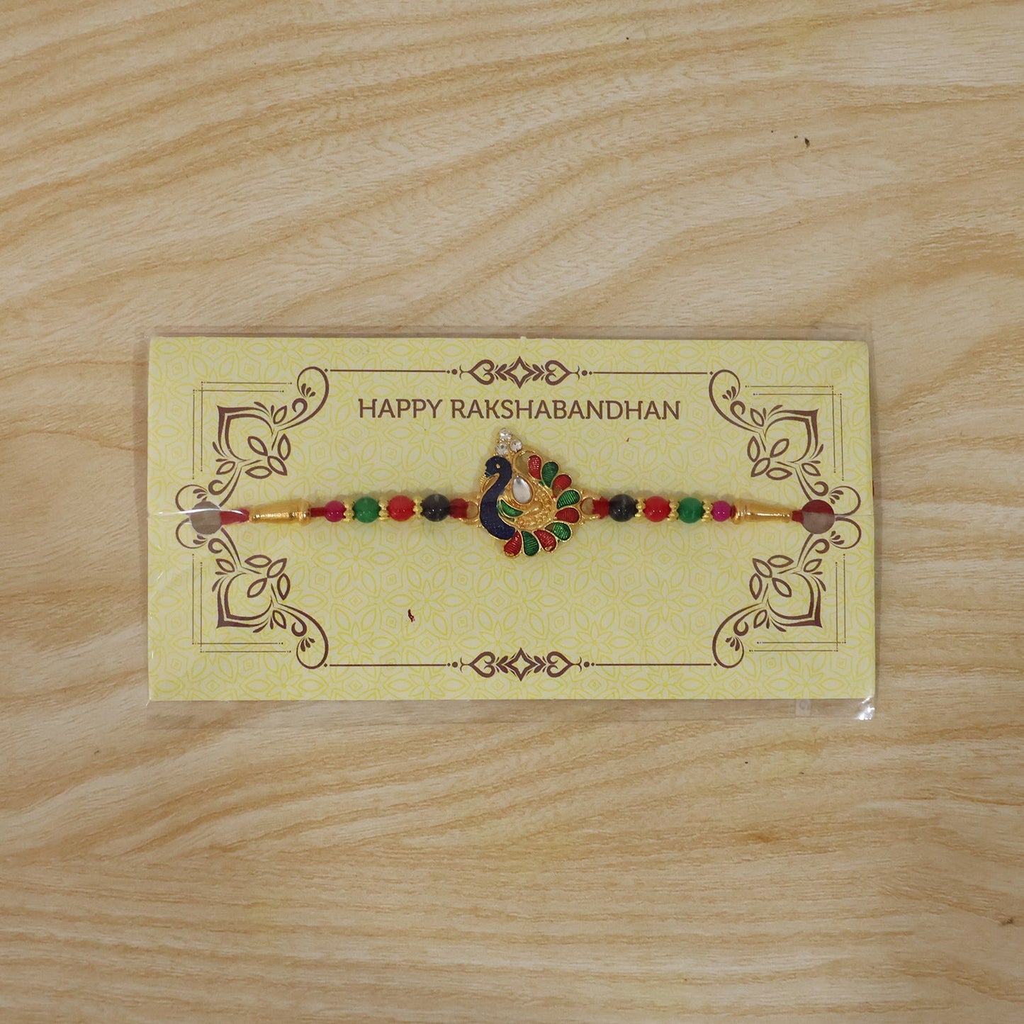 Designer Peacock Rakhi with Multicolor Beads (1 Pc)