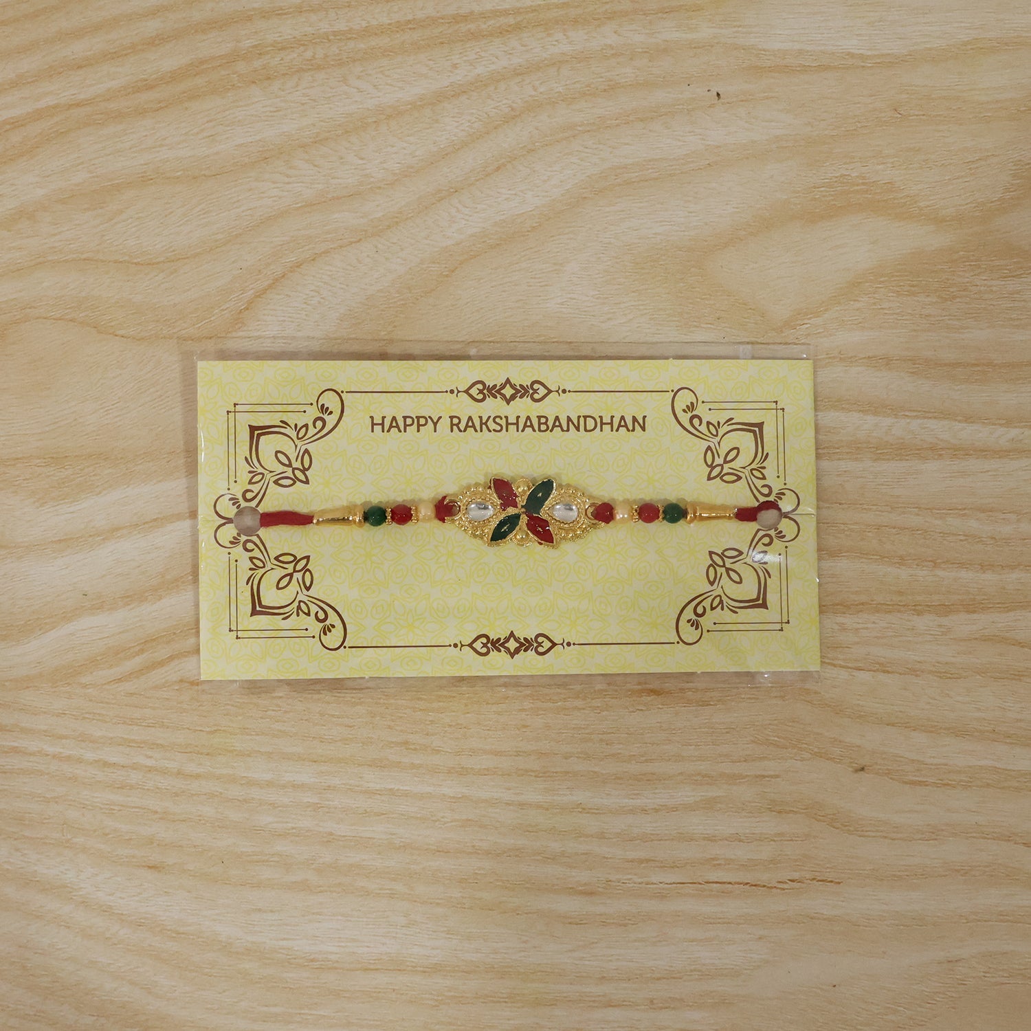 Front view of Floral Leaf Rakhi with beads