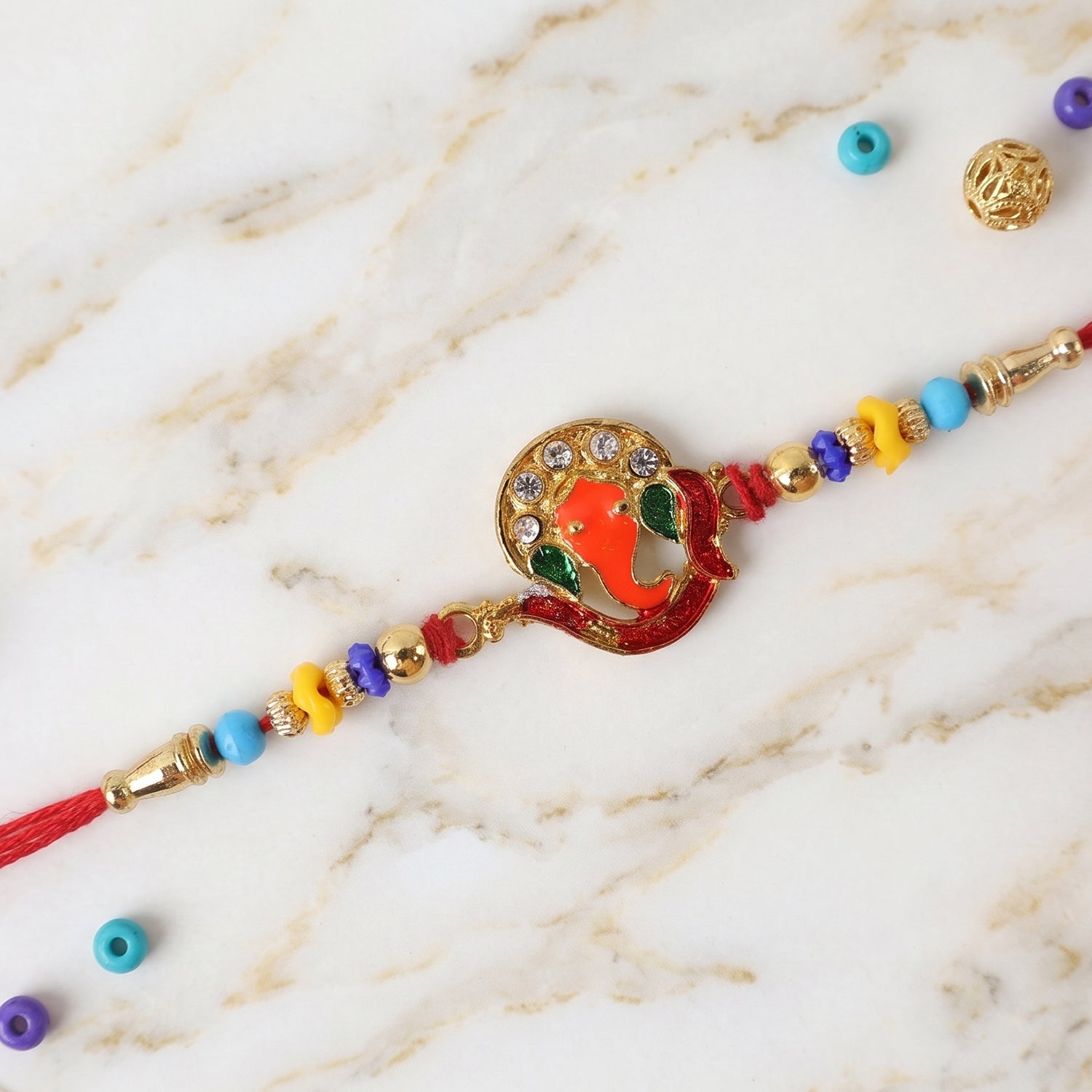 Side view of Ganesh design Rakhi with beads