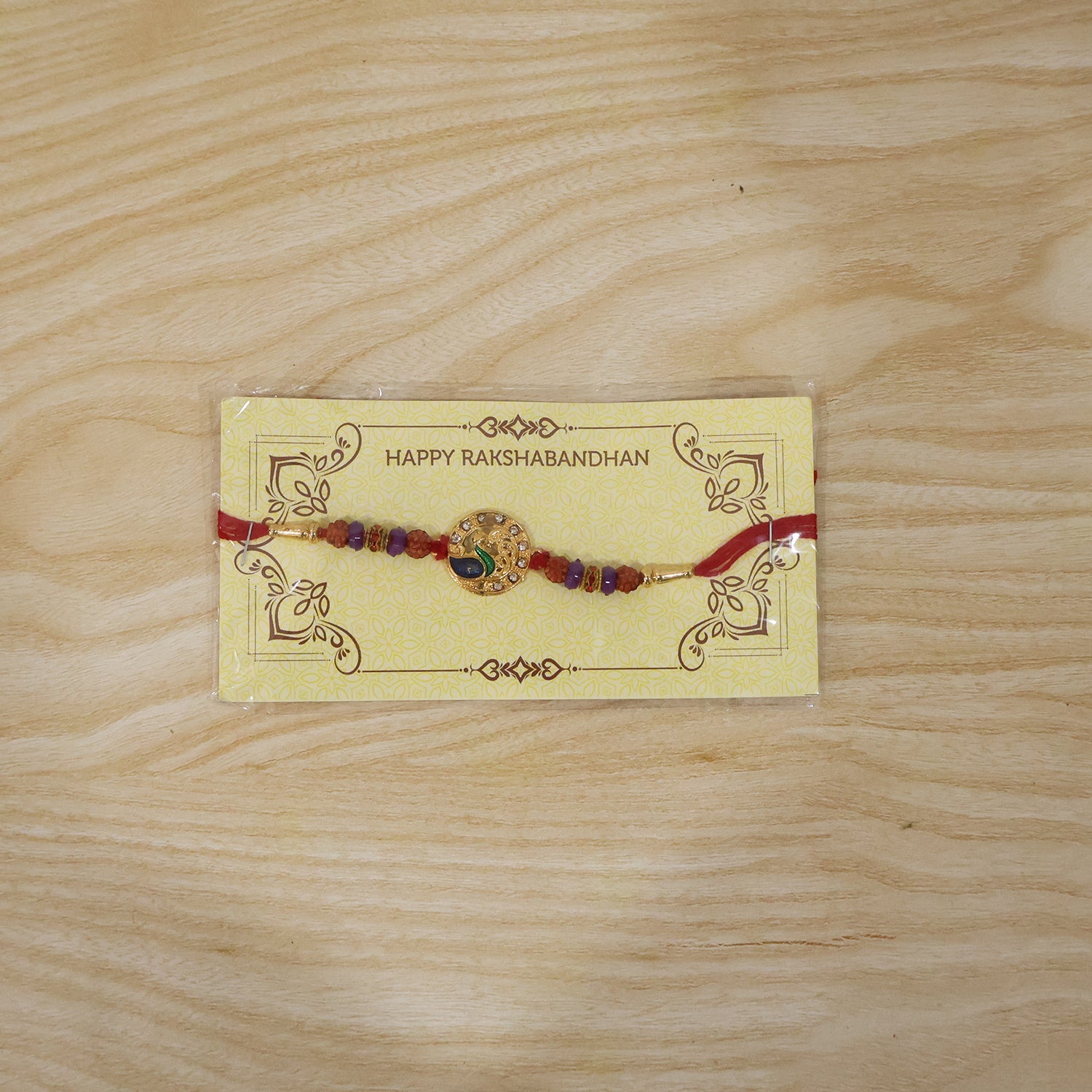 Complete Peacock Design Rakhi with decorative elements