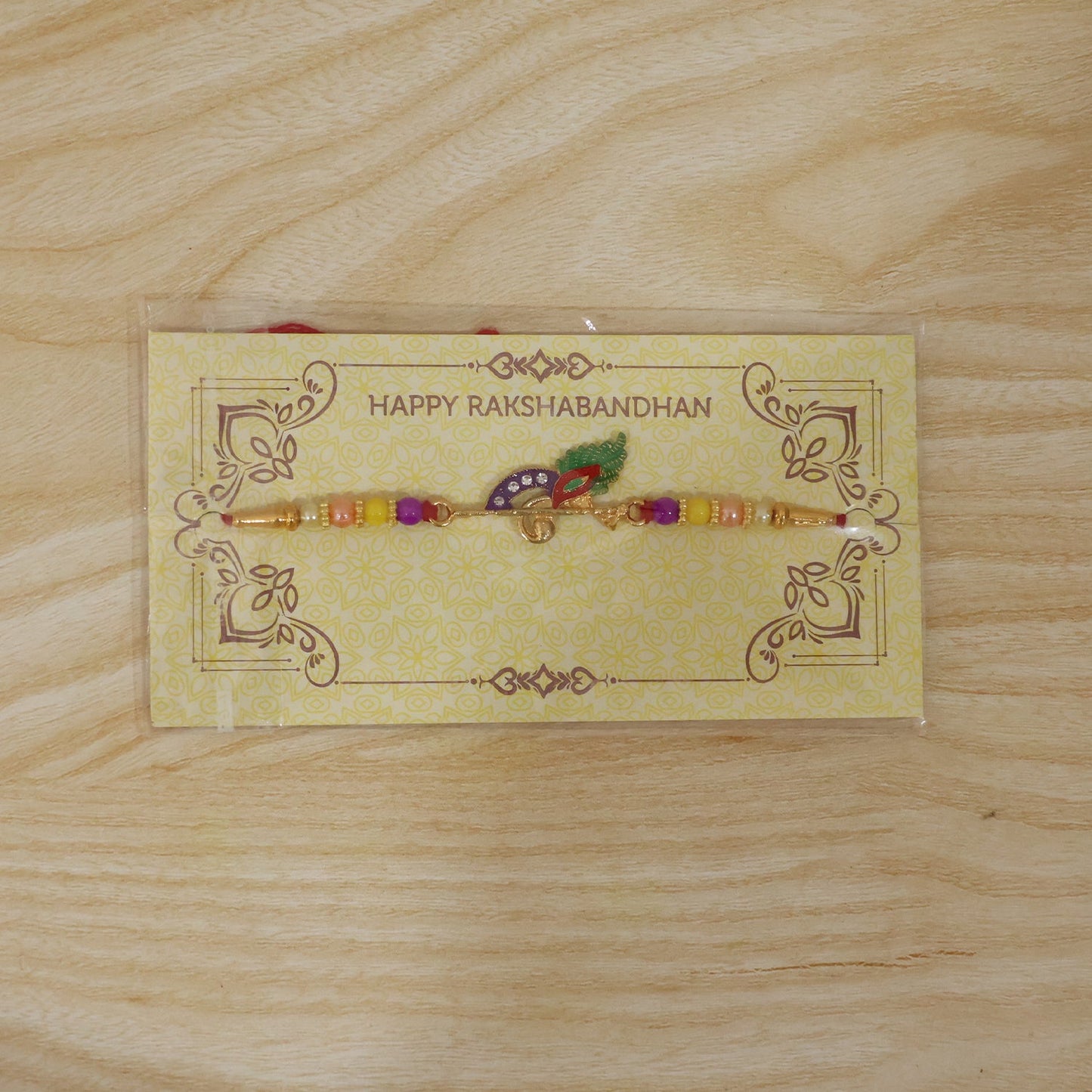 Peacock Feather Flute Design Rakhi with Beads (1 Pc)