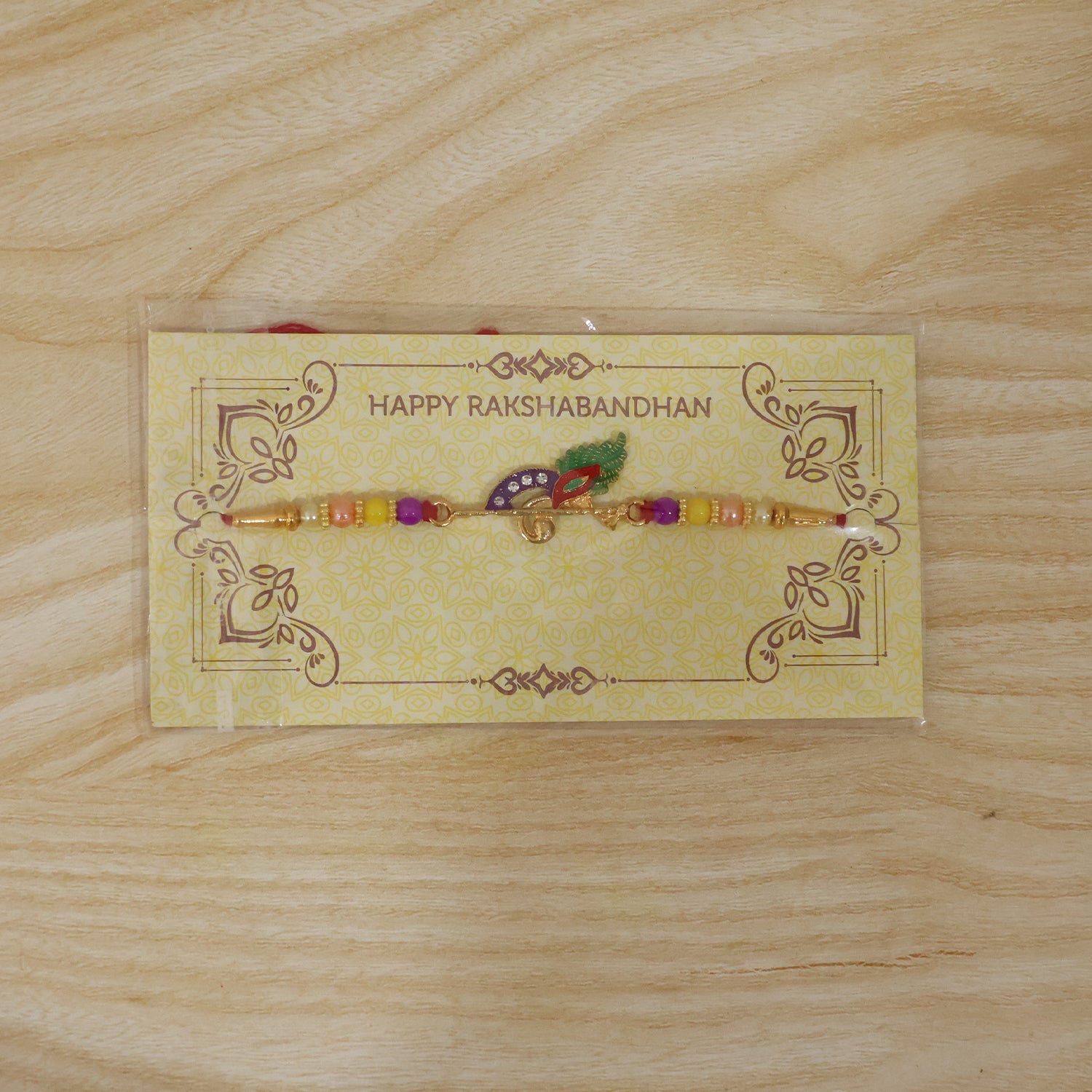 Peacock Feather Flute Design Rakhi with Beads (1 Pc)