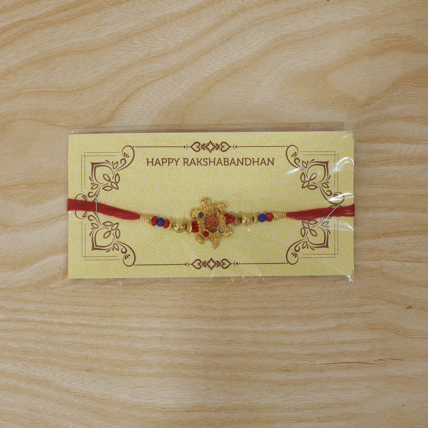 Om Turtle Design Rakhi with Colorful Beads (1 Pc)