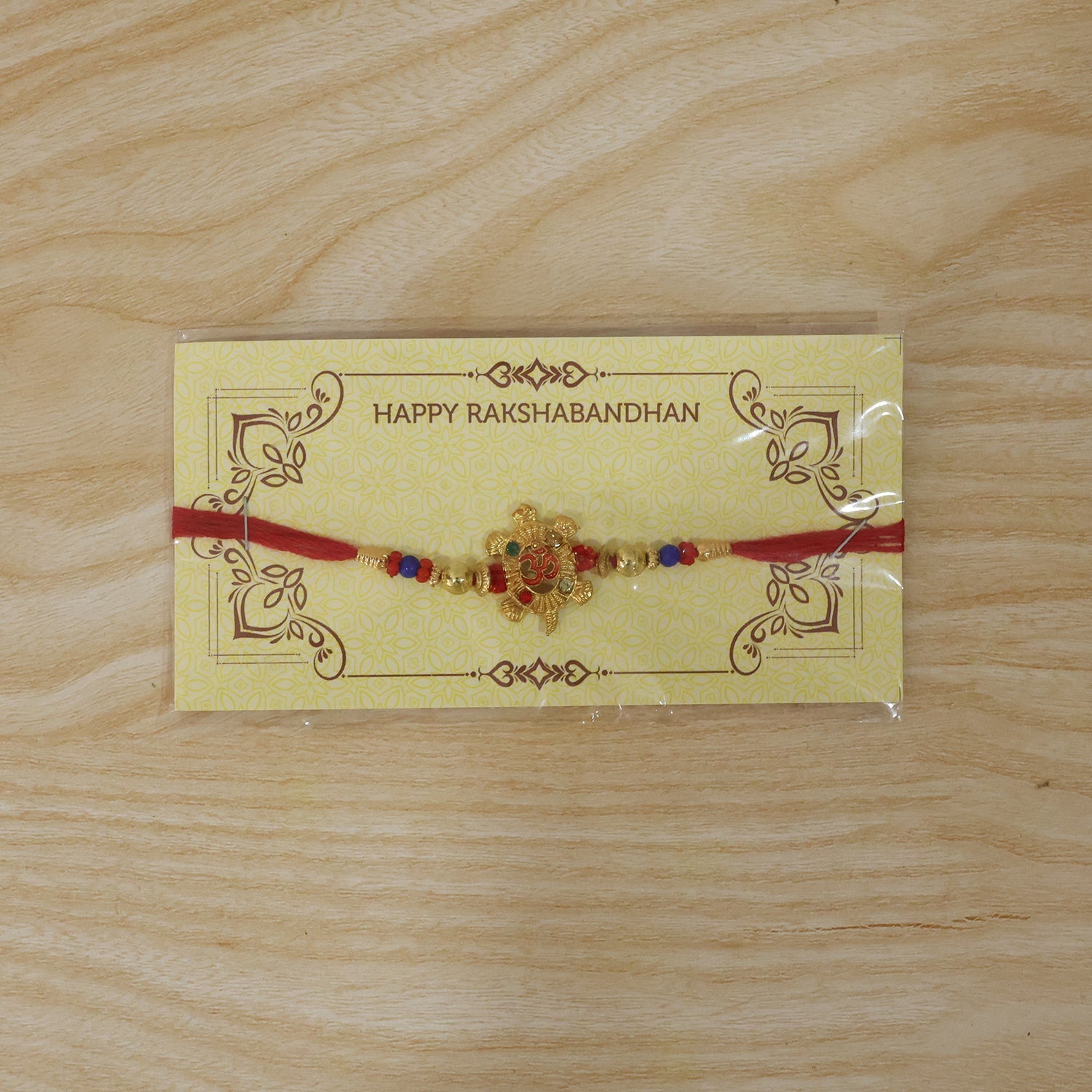 Om Turtle Design Rakhi with Colorful Beads (1 Pc)