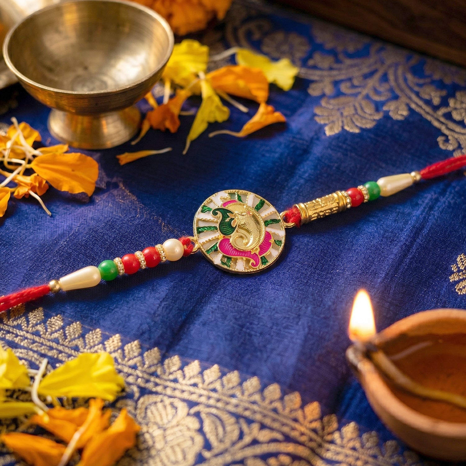 Traditional Rakhi with Ganesh design and decorative beads close-up