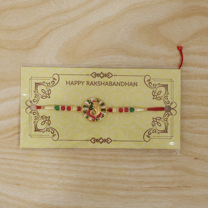 Top view of decorative Ganesh Rakhi highlighting beadwork