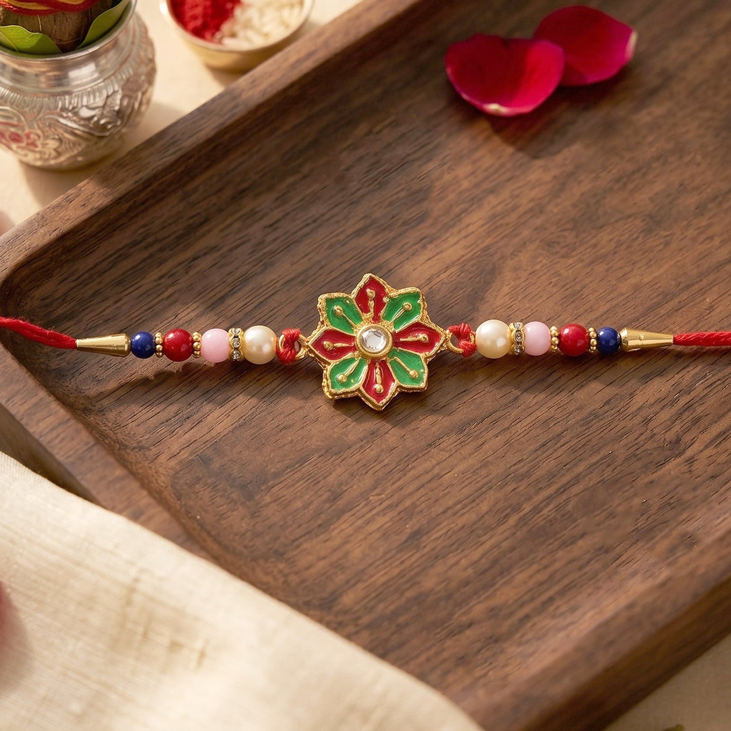 Close-up of designer Rakhi floral centerpiece with beads