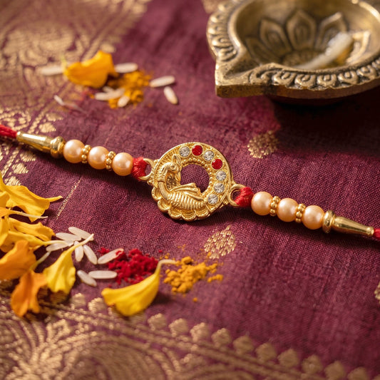 Traditional rakhi thread tied around wrist with peacock design