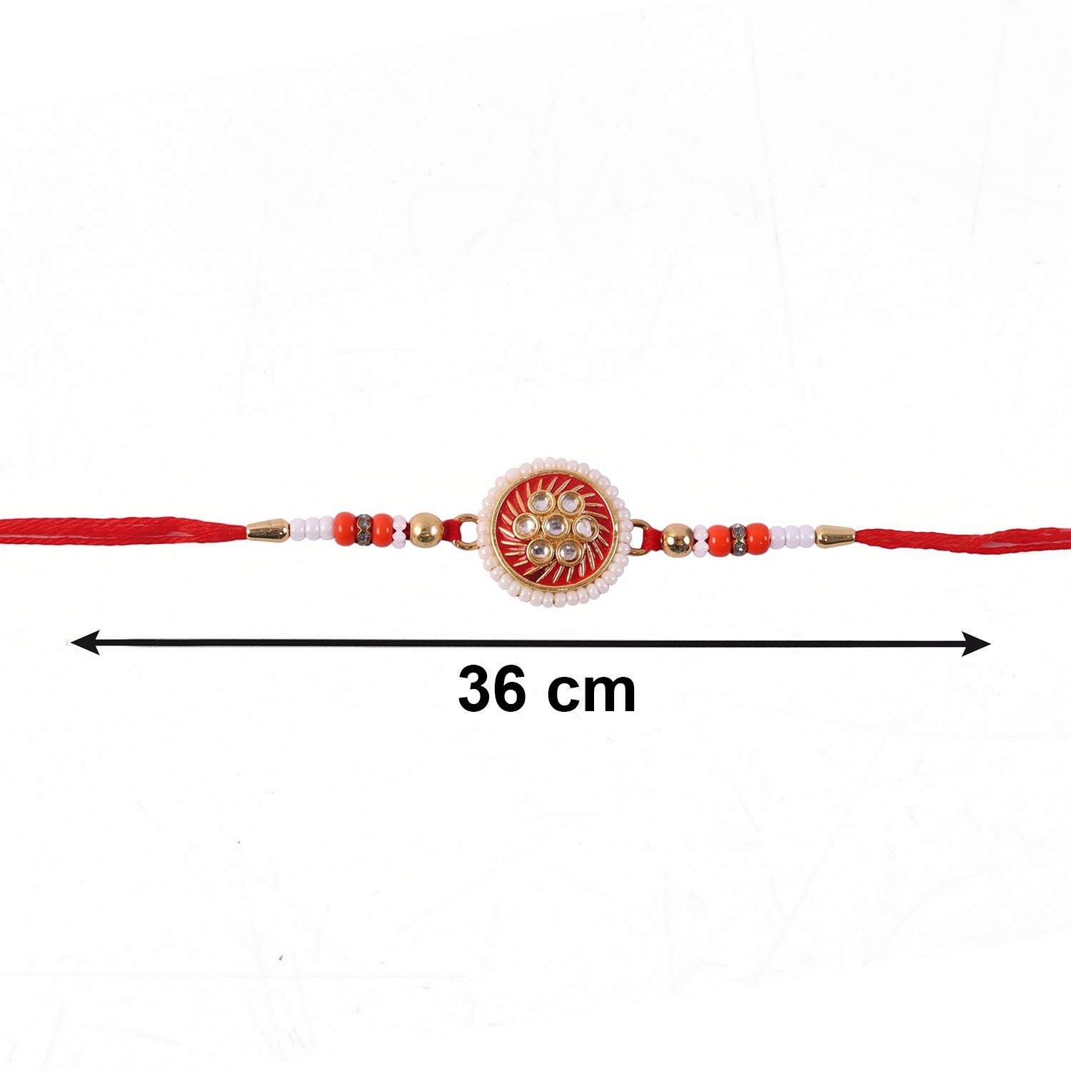 Golden floral rakhi displayed with soft thread details