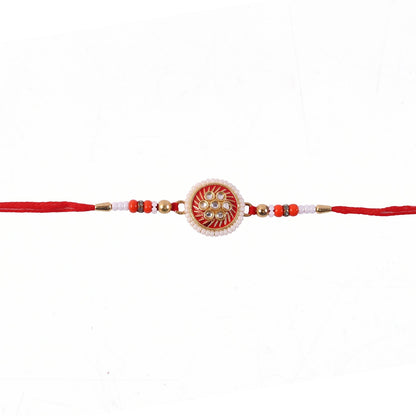 Close-up of colorful beads on floral rakhi design
