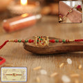 Rakhi – Traditional thread with decorative peacock centerpiece
