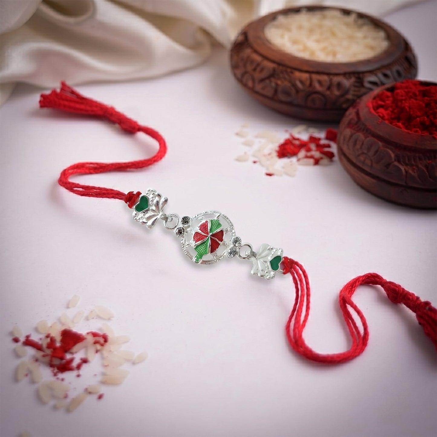 Silver Floral Design Rakhi with Red Thread (1 Pc)