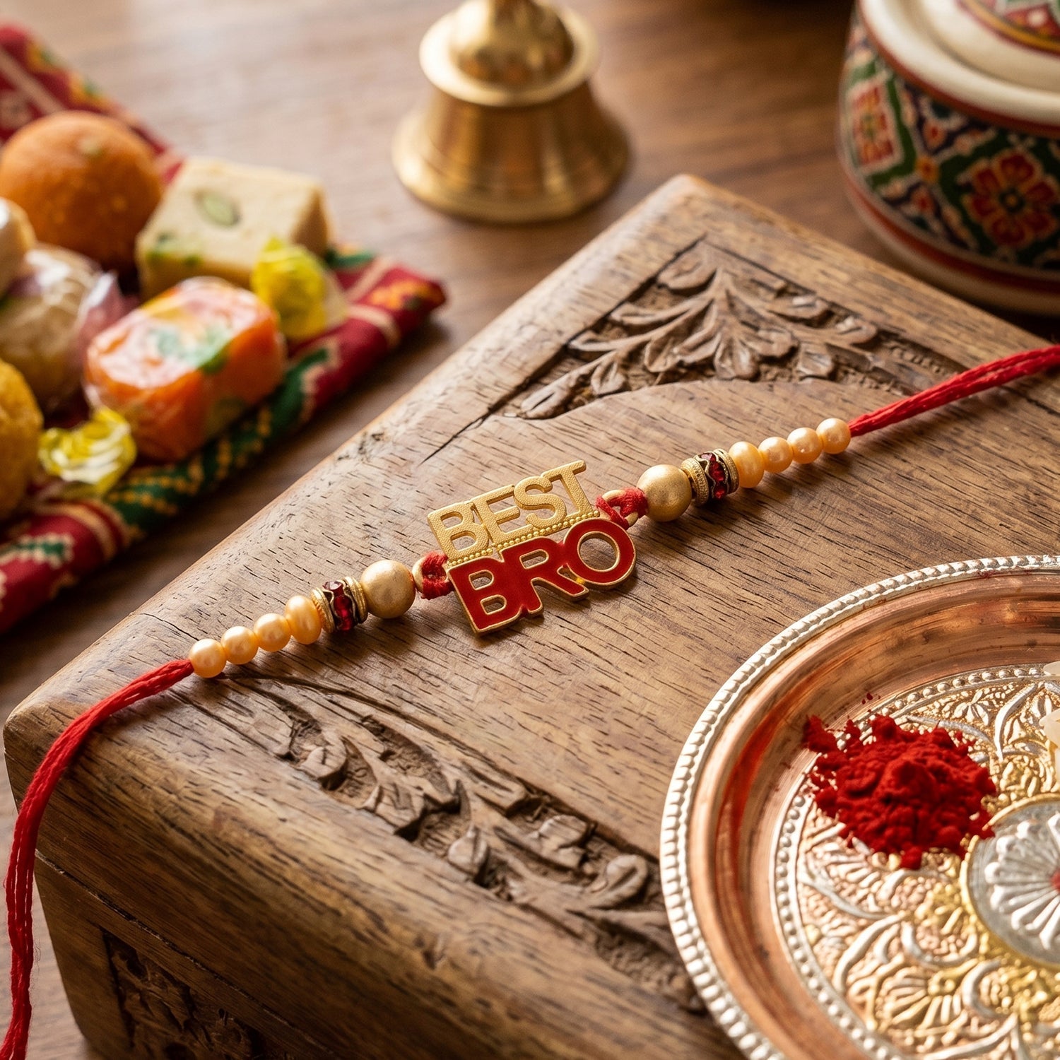 Side view of designer Rakhi with pearl beads