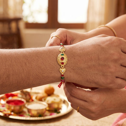 Close-up of Gold Stone Designer Rakhi colorful beads