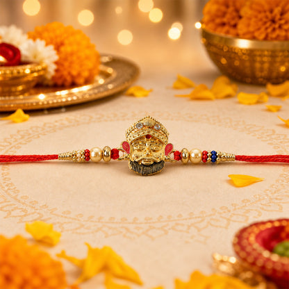 Traditional designer rakhi with red thread and beads close up