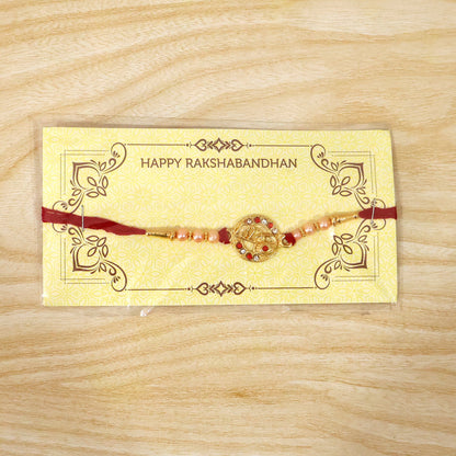 Festive setting featuring Radhe Designer Rakhi on red background