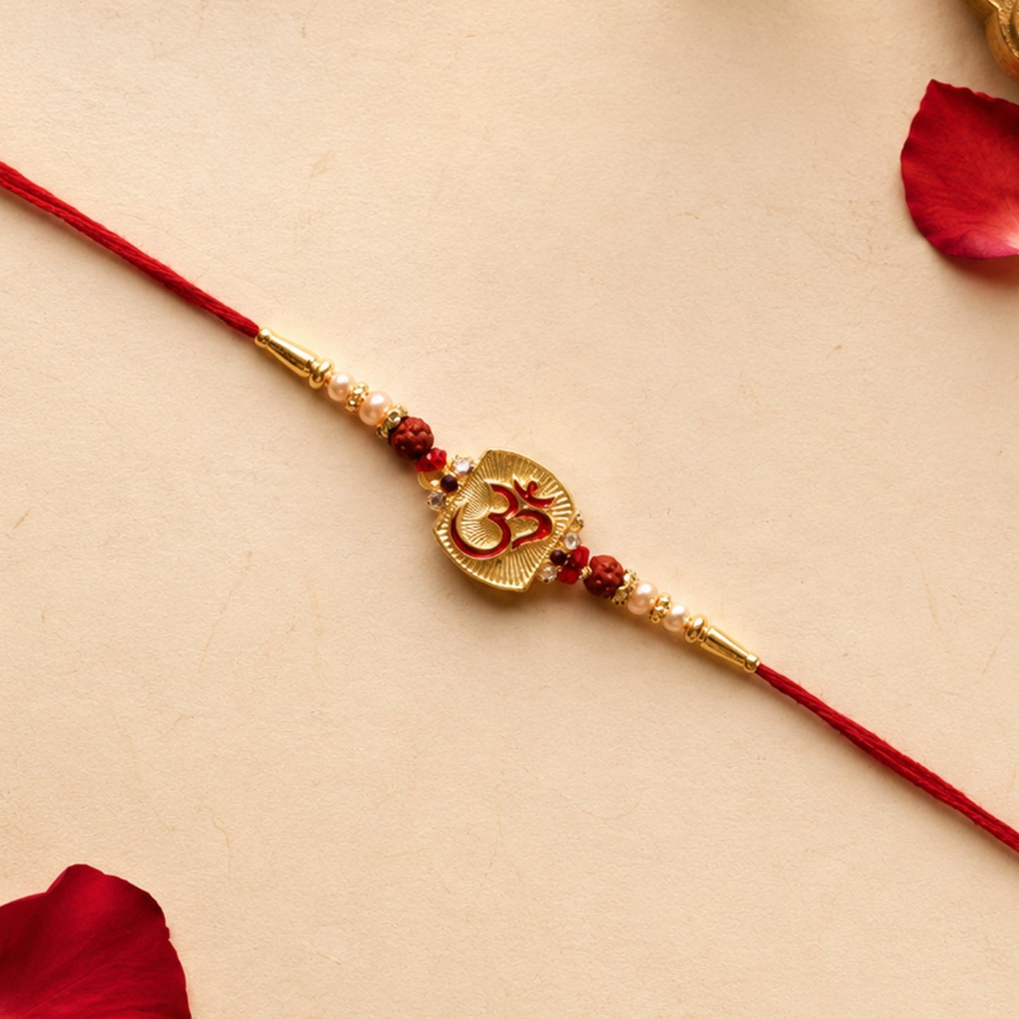 Front view of Om Designer Rakhi with Rudraksha Beads