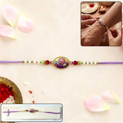 Floral Designer Rakhi with purple thread on white background
