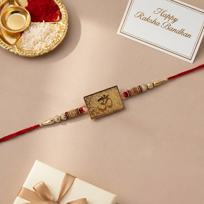 Om designer rakhi displayed on decorative background
