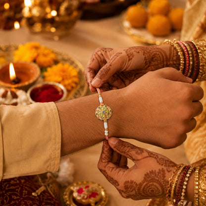 Close-up of white beads on floral rakhi