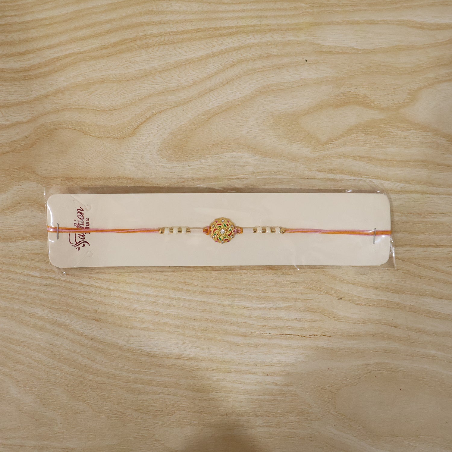 Floral round rakhi with beads, traditional and modern style