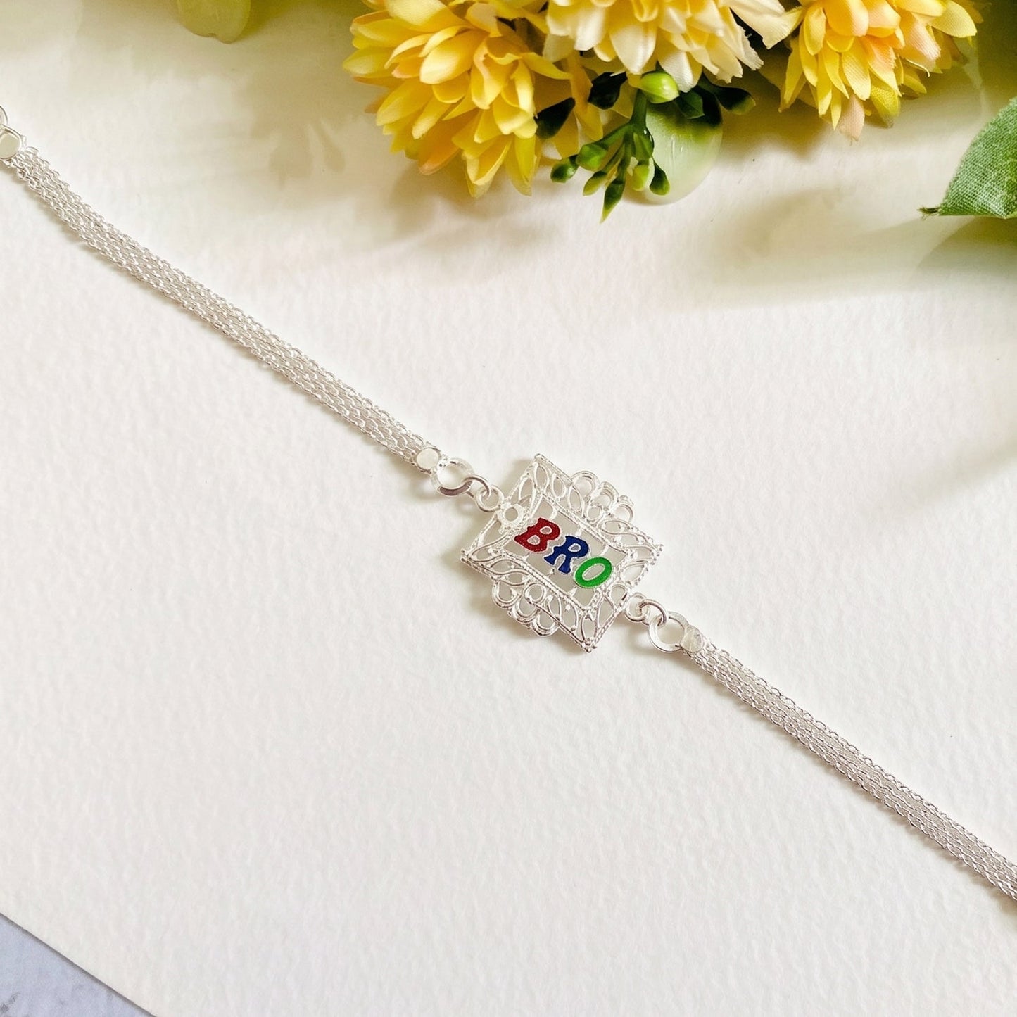 Silver Bro Rakhi with Designer Square Frame (1 Pc)