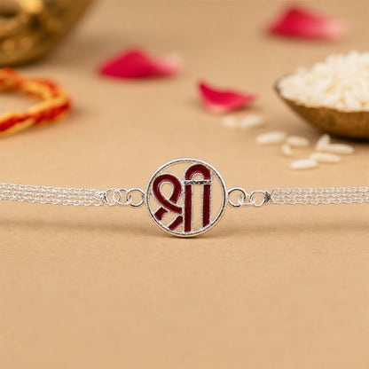 Close-up of round elegant center plate of Silver Shree Chain Rakhi
