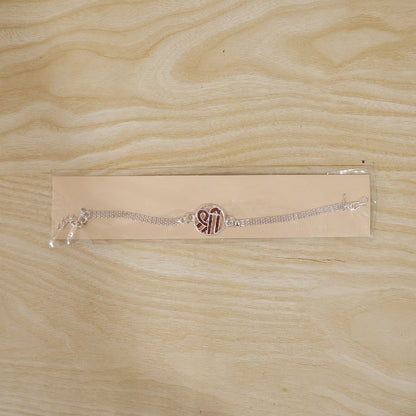 Silver Shree Chain Rakhi displayed with festive décor