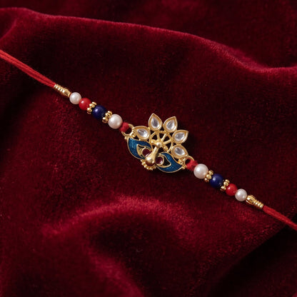 Peacock Designer Rakhi with Pearl Beads and Red Thread (1 Pc)
