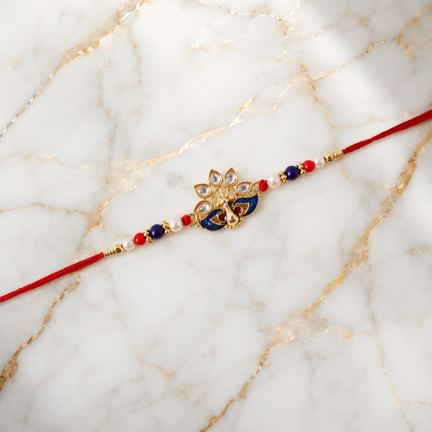Peacock Designer Rakhi with Pearl Beads and Red Thread (1 Pc)