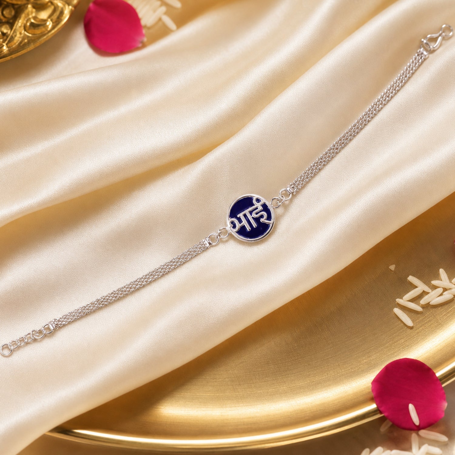 Side view of Silver Bhai Chain Rakhi with blue round design