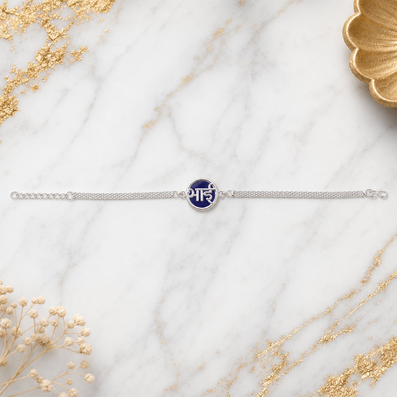 Silver Bhai Chain Rakhi blue round centerpiece close-up