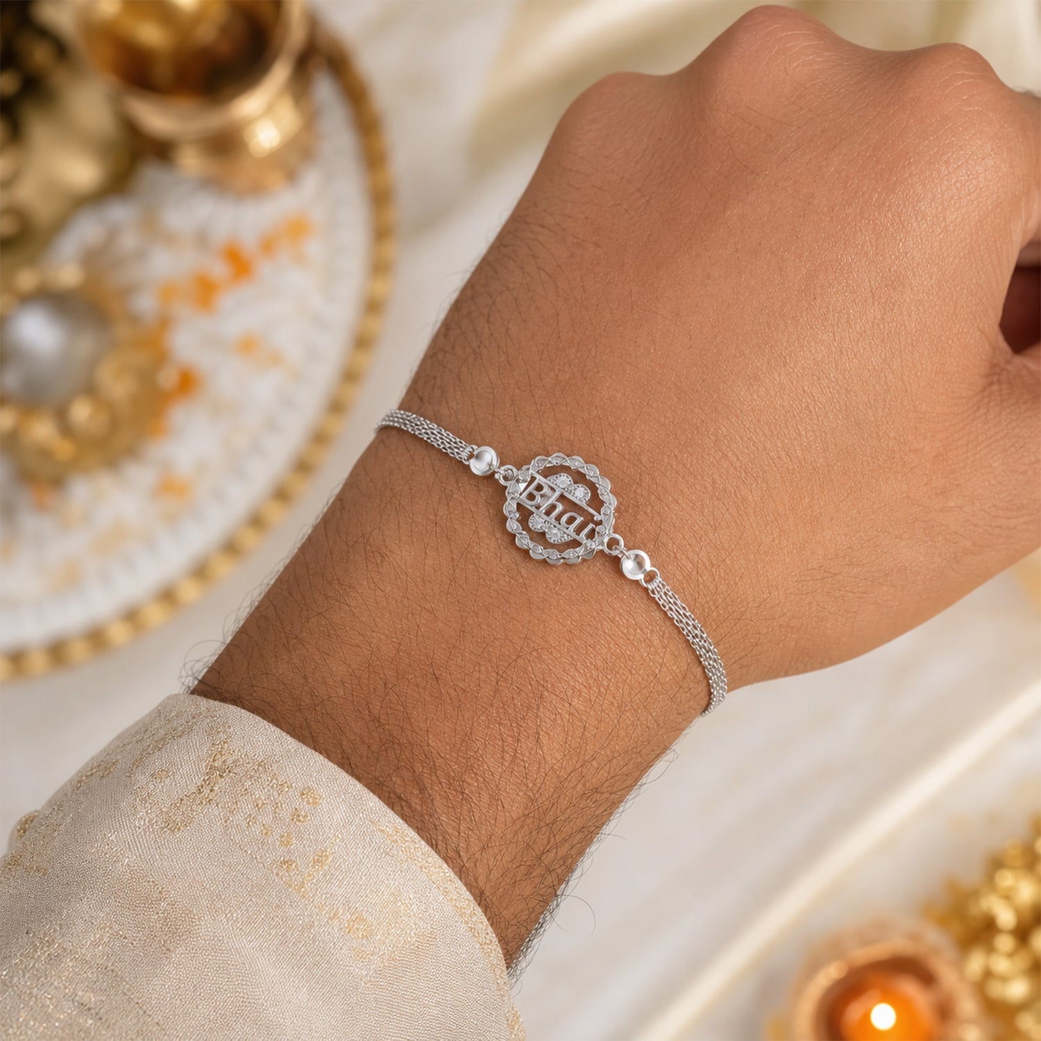 Close-up of silver rakhi round charm detail