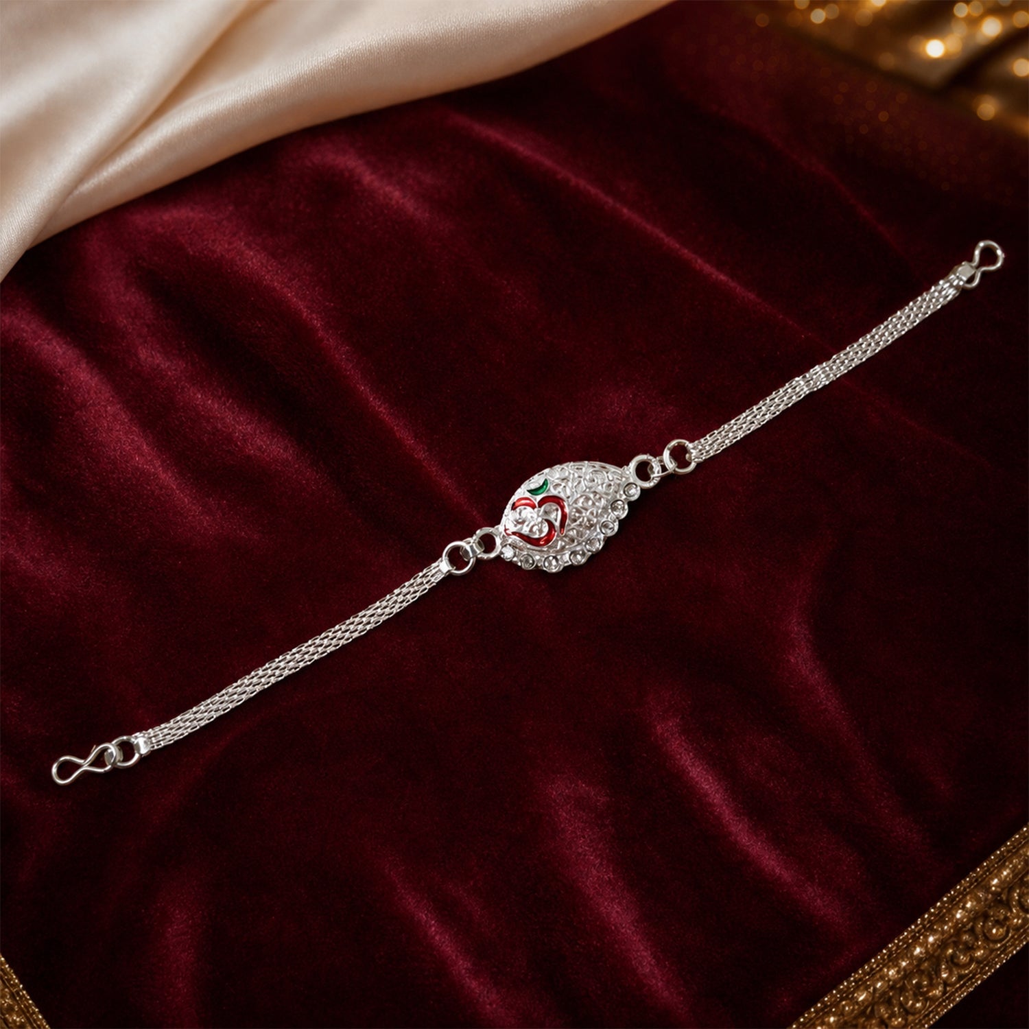 Silver Om Chain Rakhi worn on wrist