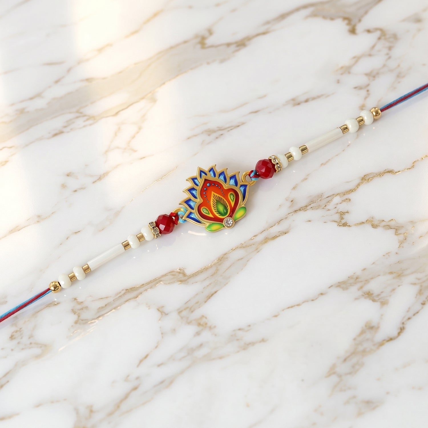 Designer rakhi showing colorful beads and feather detail