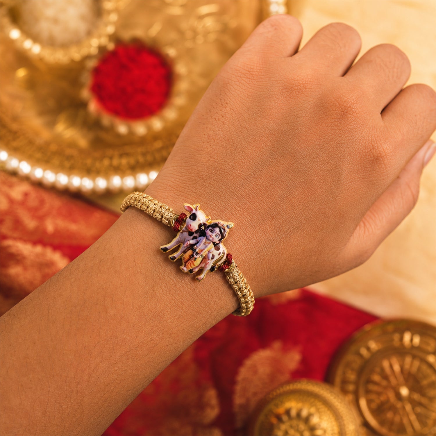 Side angle showing detailed Krishna Cow traditional rakhi