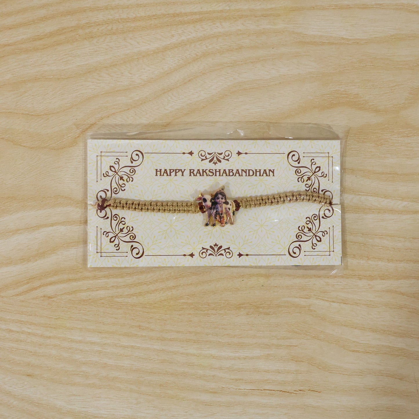 Elegant Krishna Cow traditional rakhi with neat finishing